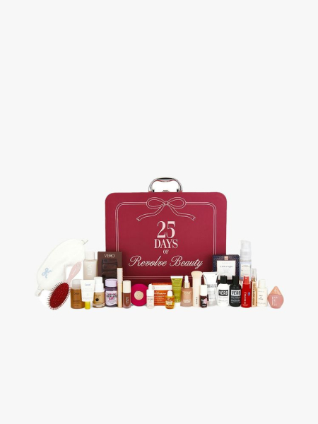 Marooncolored case with silver handle and 25 beauty products in front on light gray background