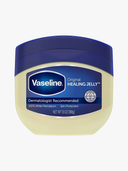 Tub of Vaseline Petroleum Jelly with blue cap on light gray background
